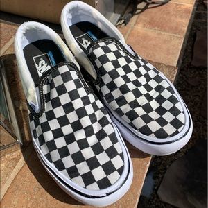 Unisex Black and White Checkered Slip On Vans